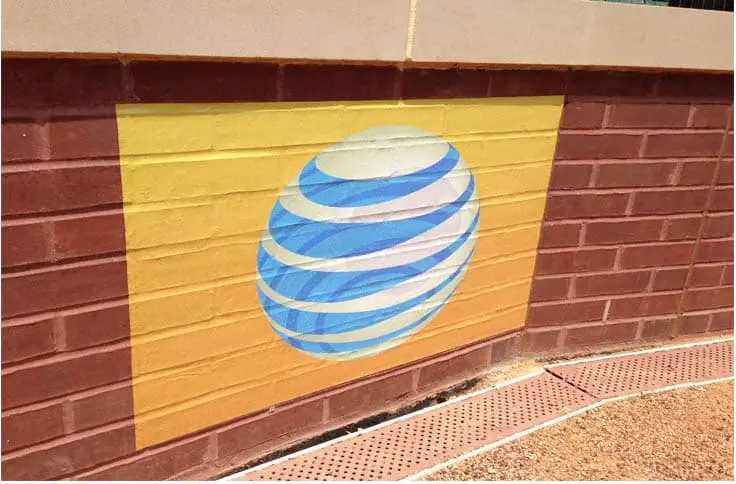 a photo of a companies logo printed on brick wall vinyl