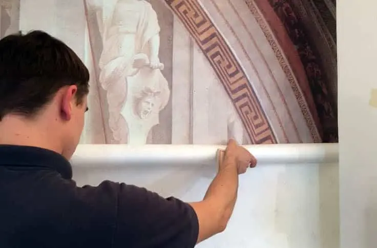printed wallpaper being installed by wallace print