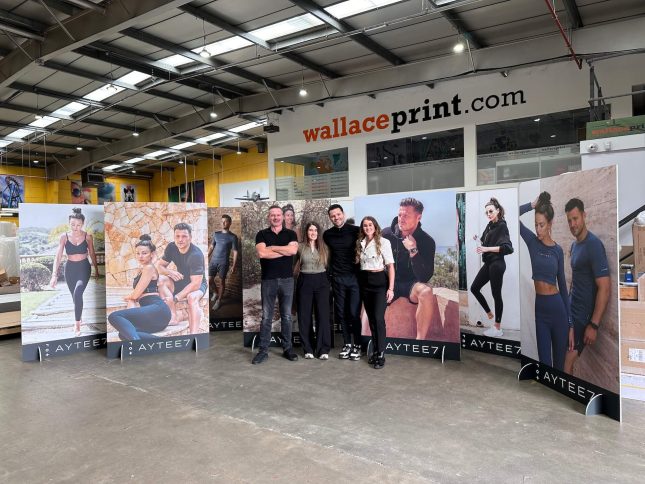 Wallace Print family with TV sensation Mark Wright receiving his printed banners