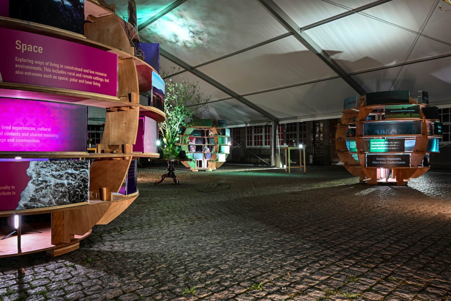 Ground-level view of Glasgow School of Art Rural Lab installation under canopy lighting.